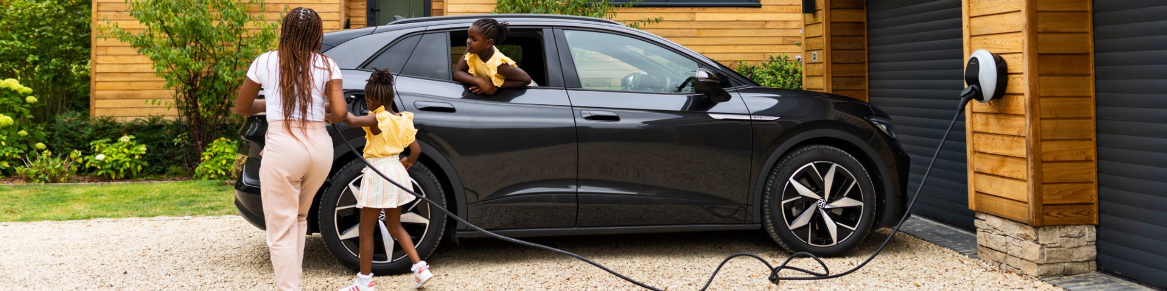 Electric car charging station with person