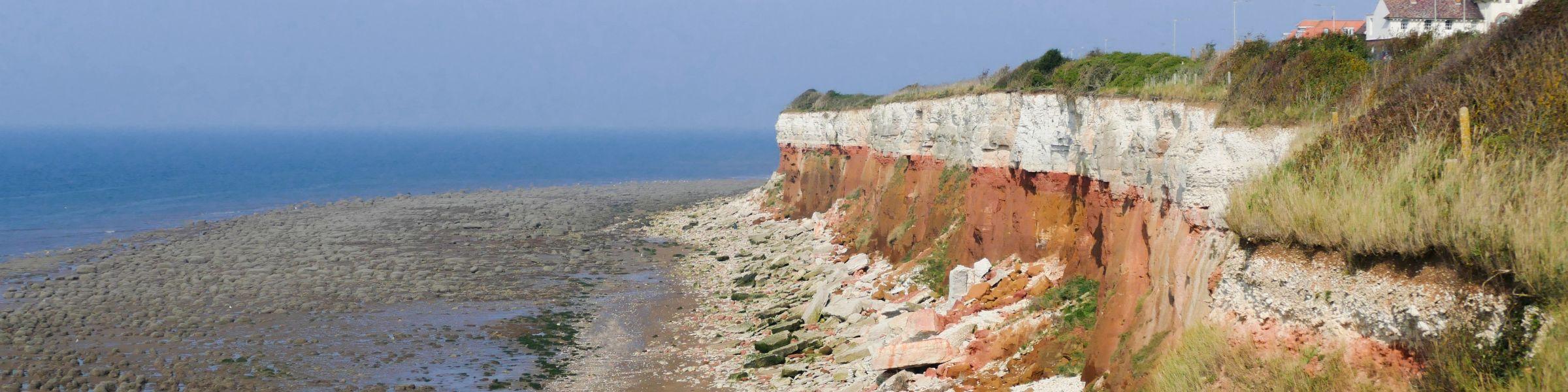 House atop cliff overlooking Norfolk coast