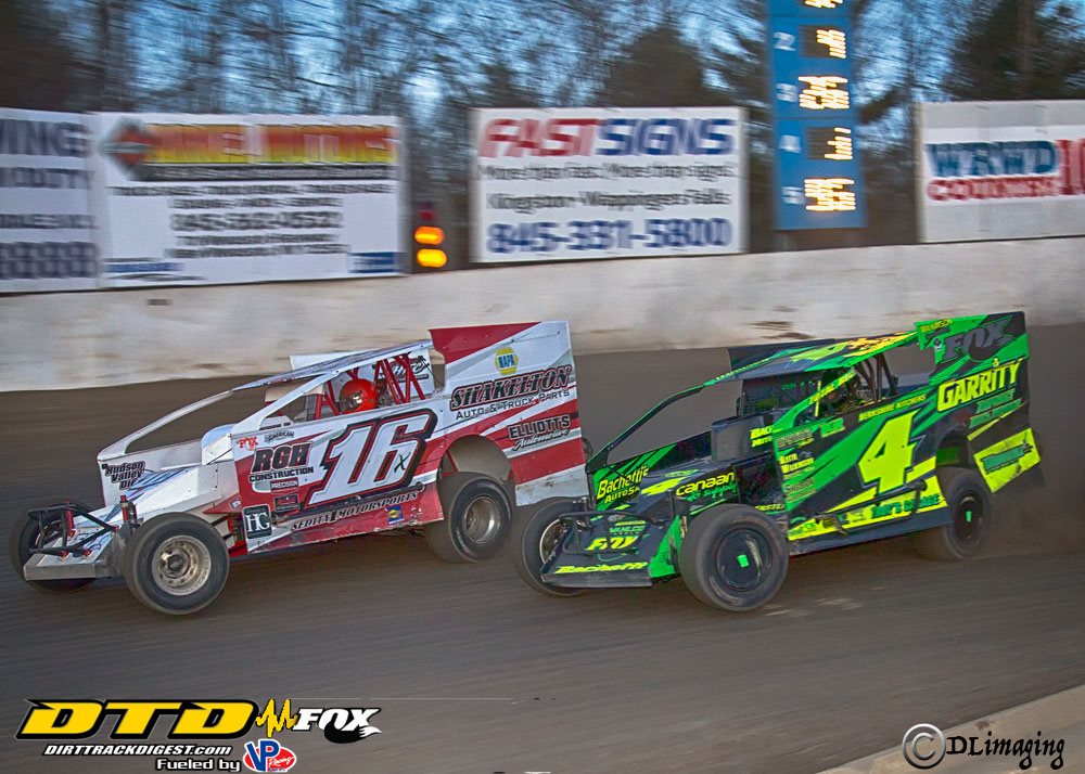 Sprint cars racing on dirt track