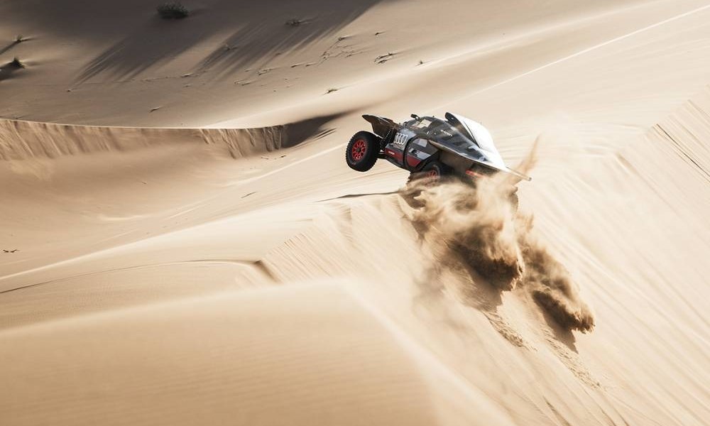 Desert buggy racing through dunes