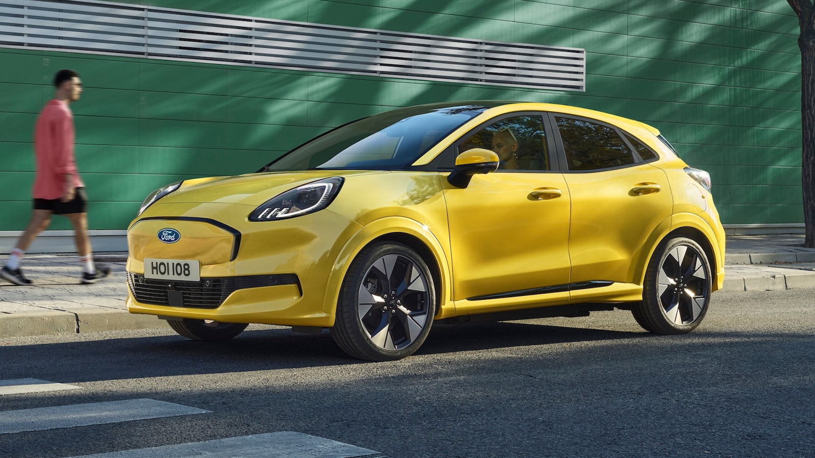 Yellow Ford Puma parked on street