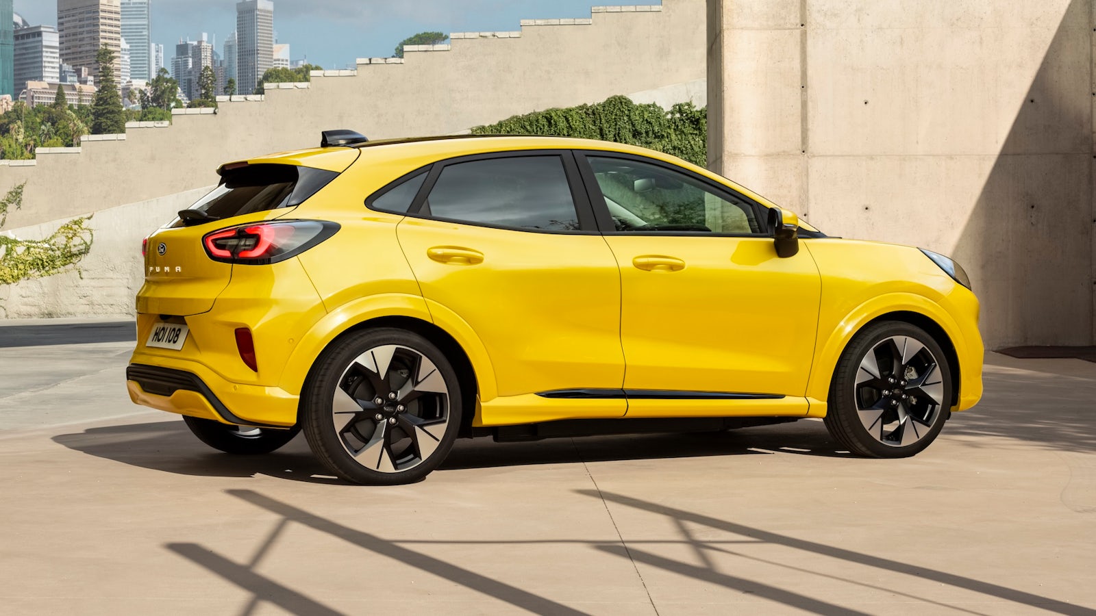 Yellow Ford Puma parked outside