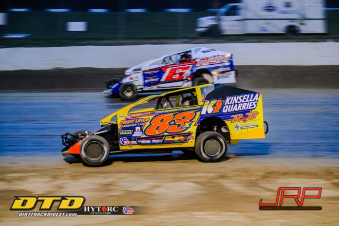 Sprint cars racing on dirt track