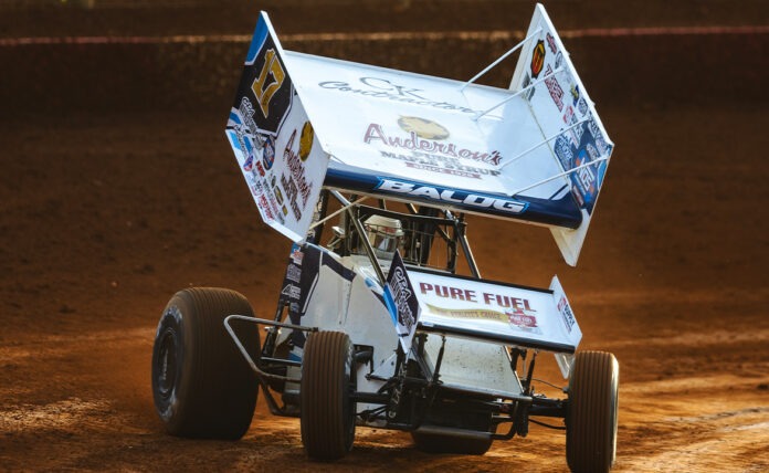 Sprint car racing on dirt track