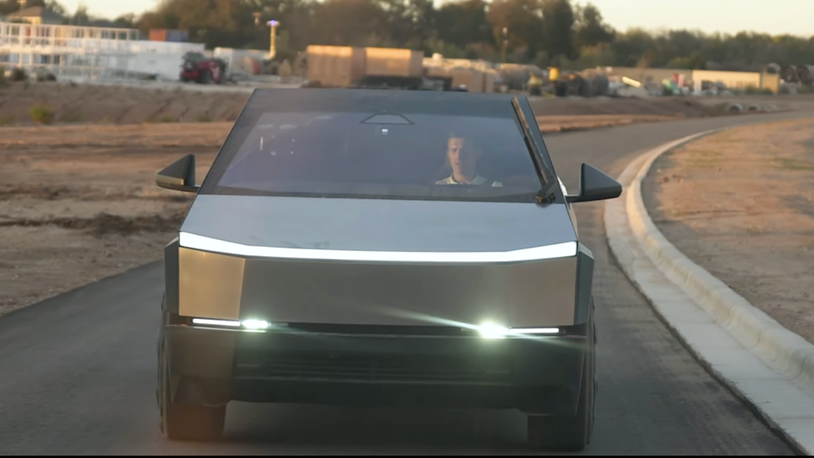 Silver Cybertruck driving on open road