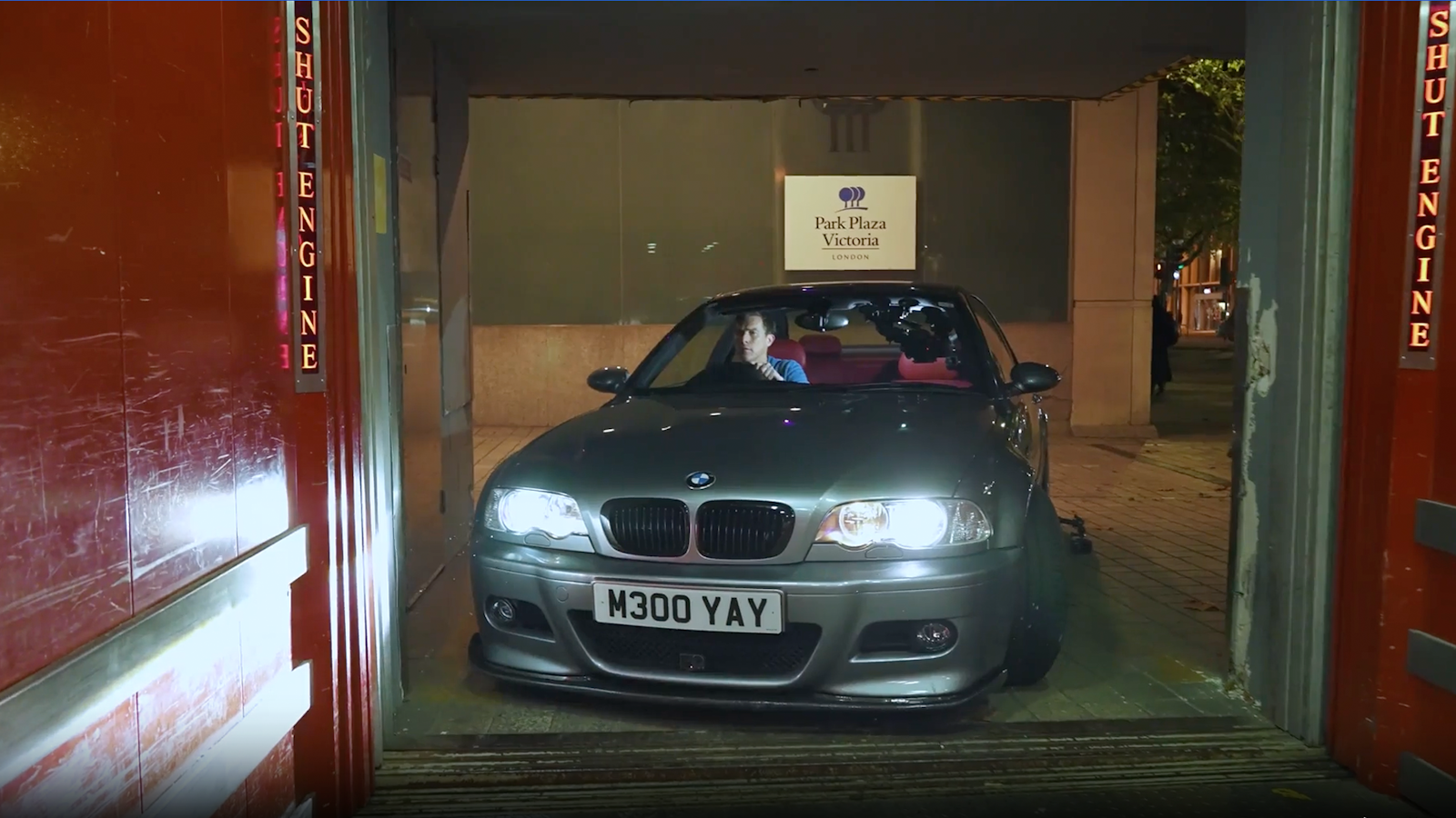 BMW M3 entering garage elevator