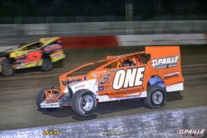 Two sprint cars racing side-by-side