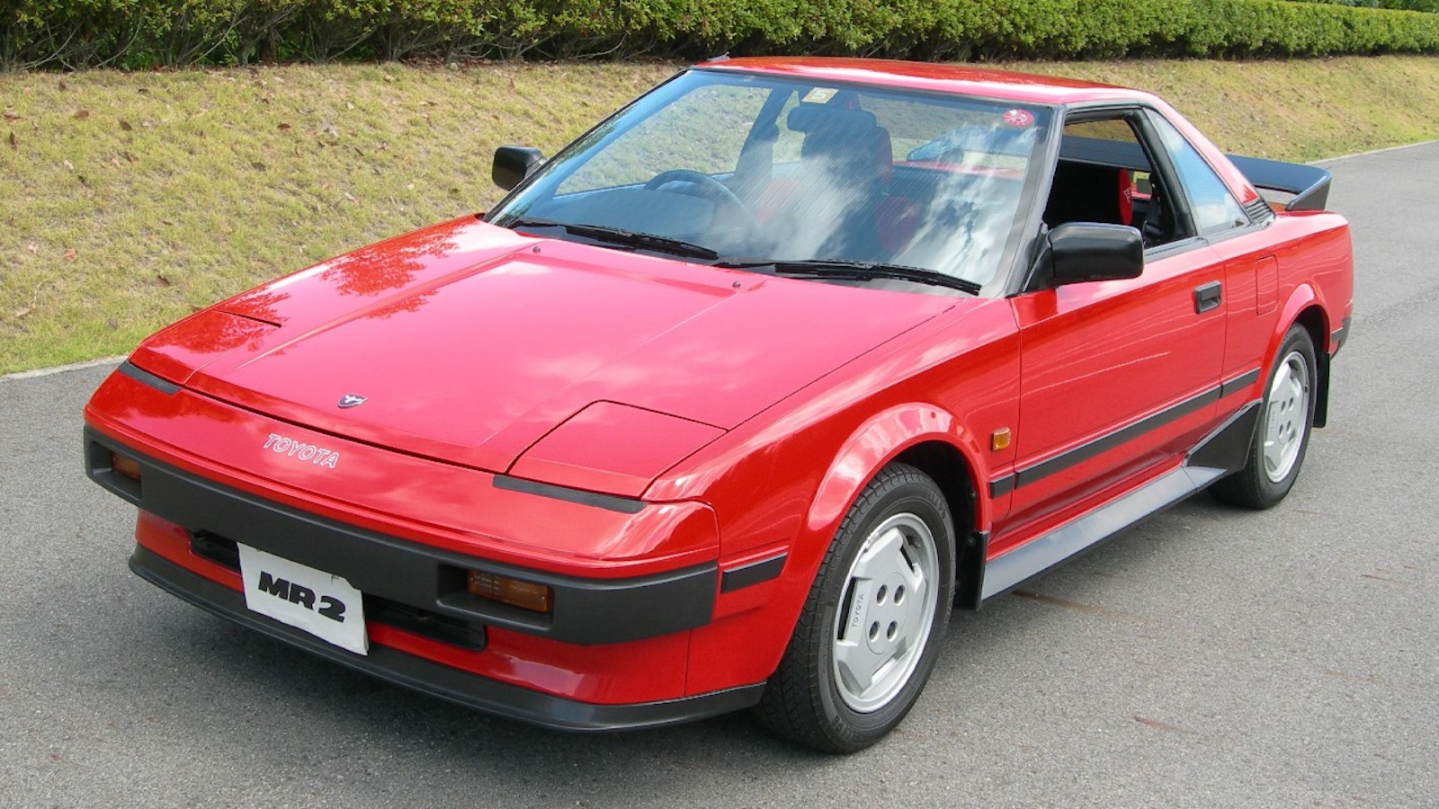 Red Toyota MR2 on white background