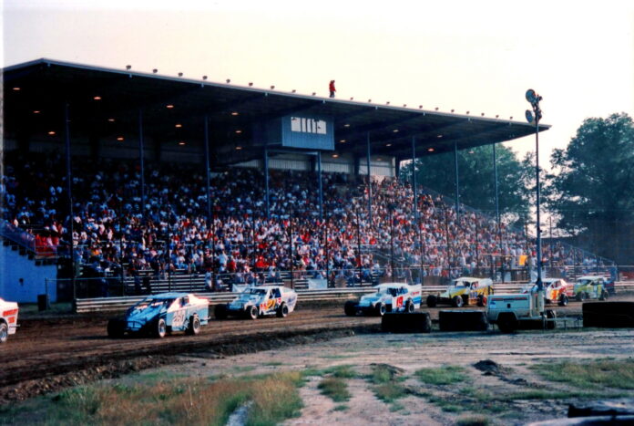 Sprint cars racing on dirt track