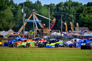 Stock cars racing on dirt