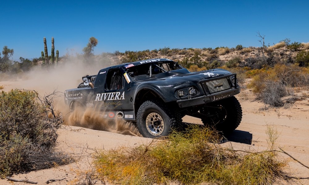 Black Diamond truck racing through desert