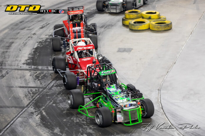 Sprint cars racing on dirt track