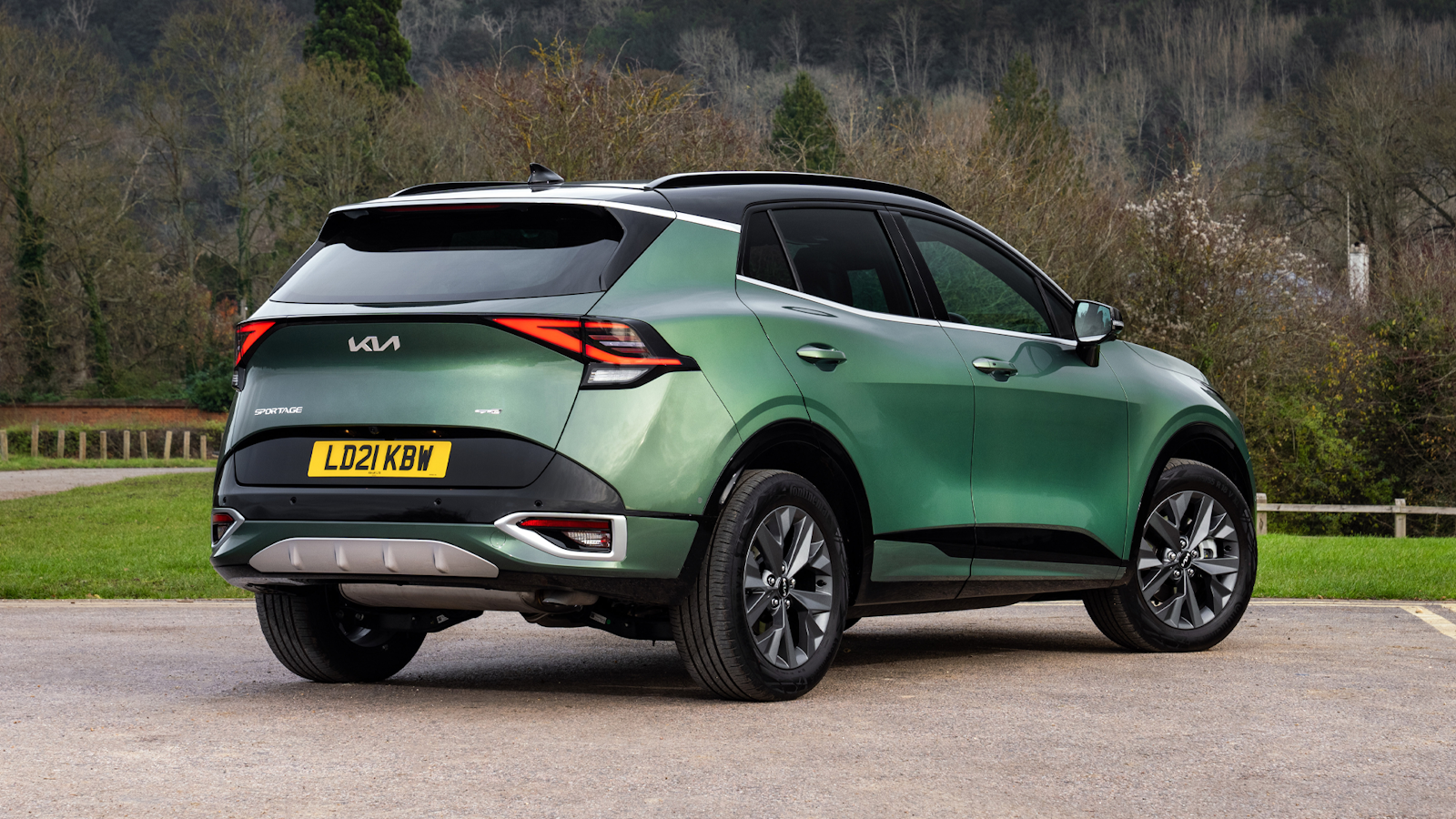 Green Kia Sportage rear view