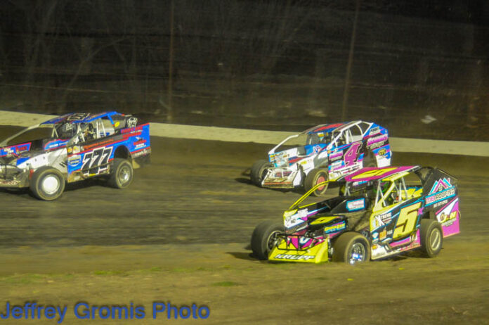 Sprint car racing on dirt track