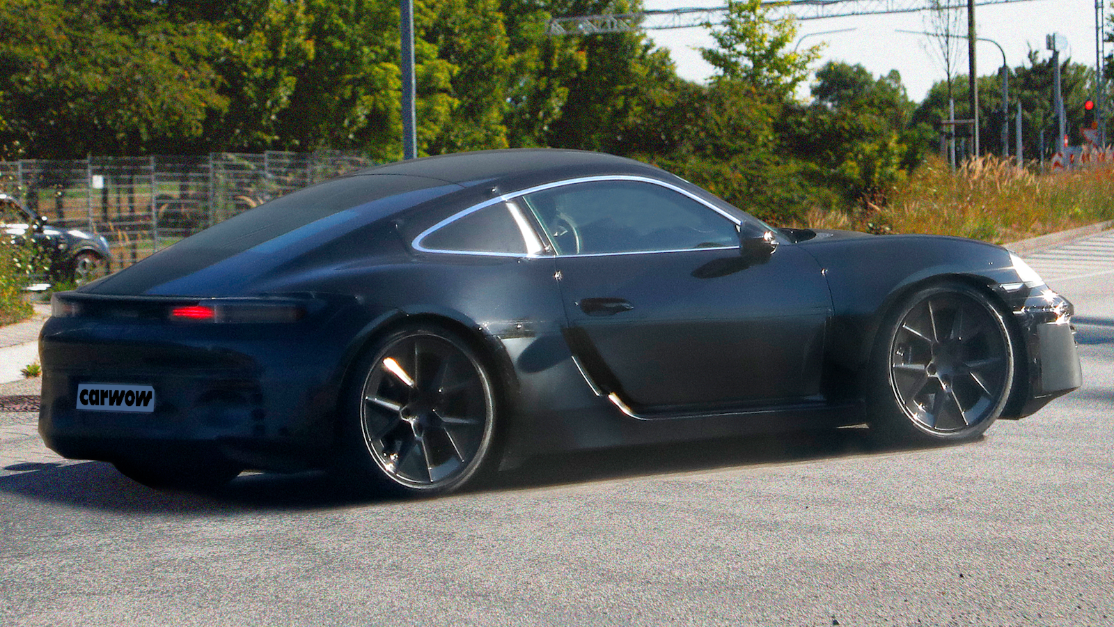 Black Porsche Cayman rear view