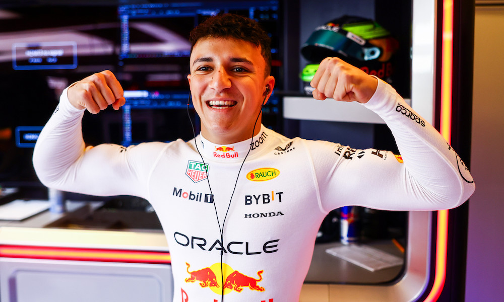 Alex Albon smiling at camera trackside