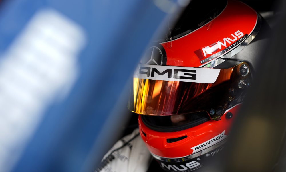 Red DTM racing helmet close-up