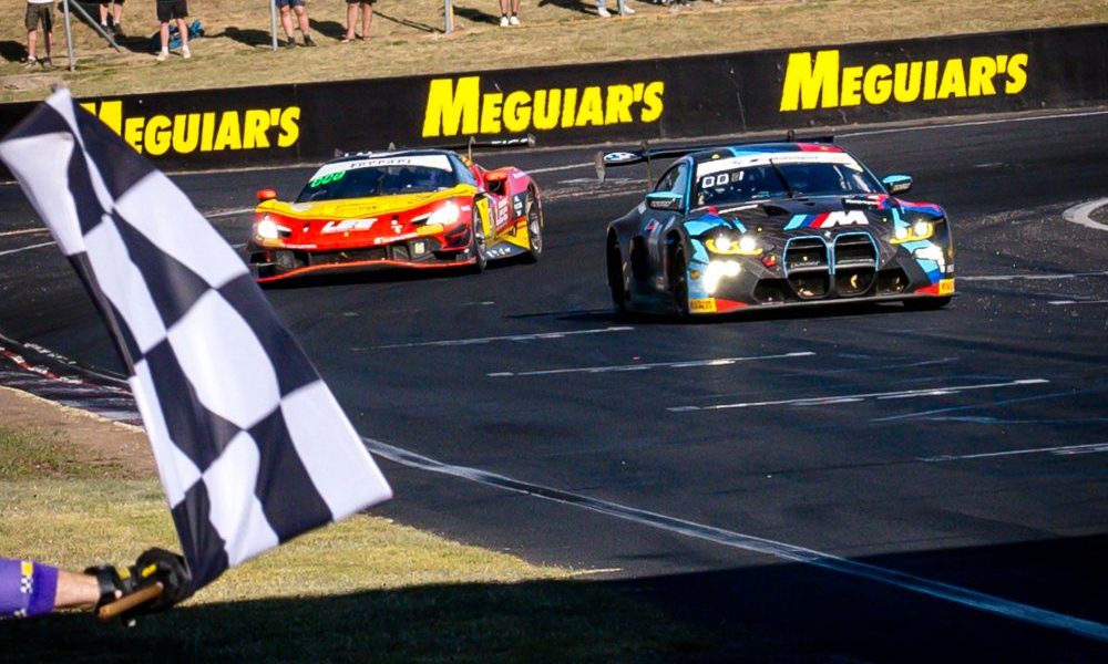 Three IndyCars racing on track