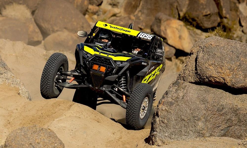 Polaris off-road vehicle racing through desert