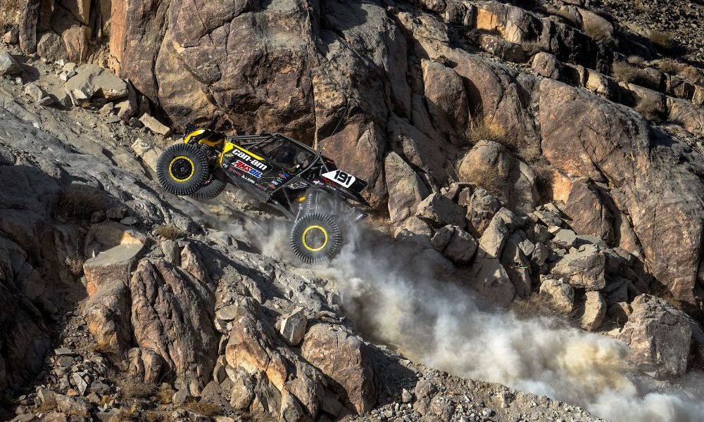 Yellow racing truck on rocky terrain