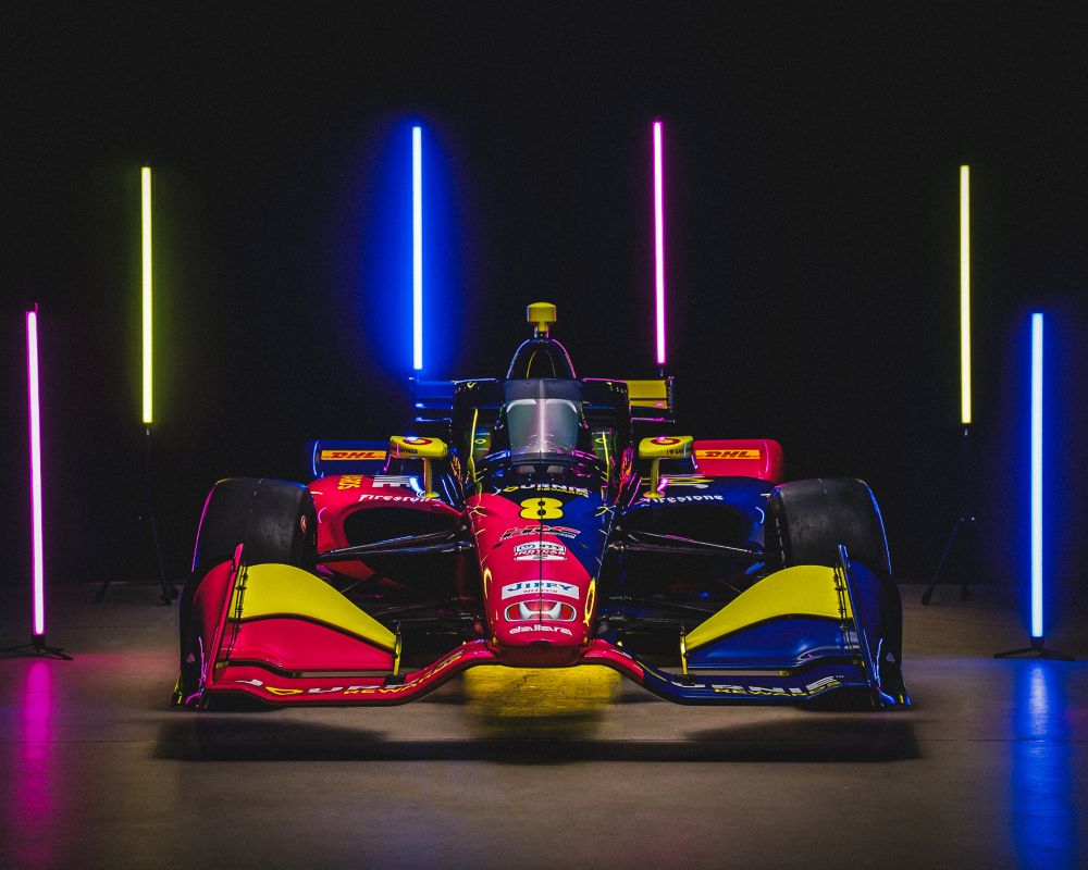 Glowing race car at night