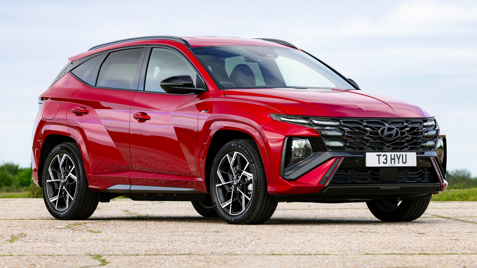 Red Hyundai Tucson front view