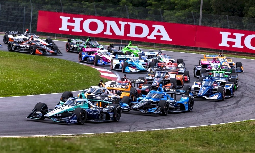 IndyCar racers compete on racetrack