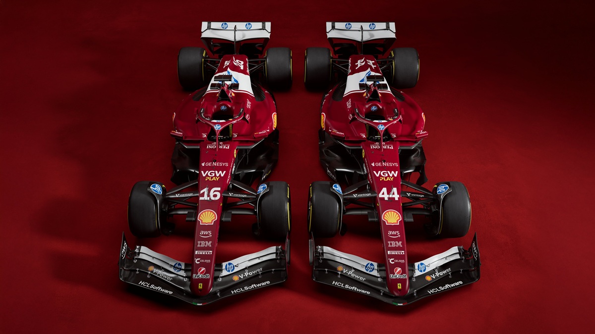 Two red Penske IndyCars side-by-side