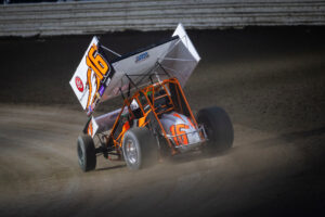 Sprint car racing on dirt track