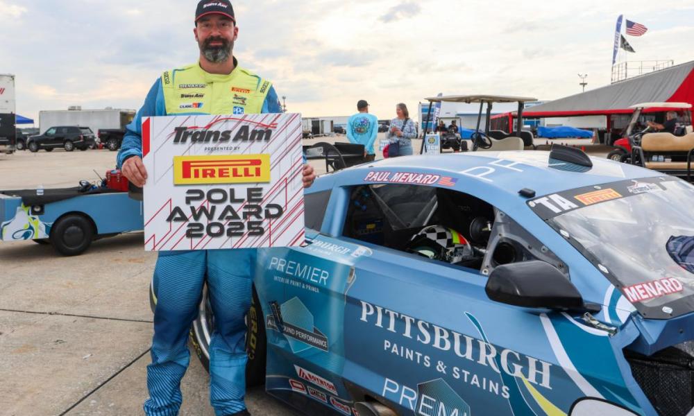 Driver with sign at Sebring racetrack