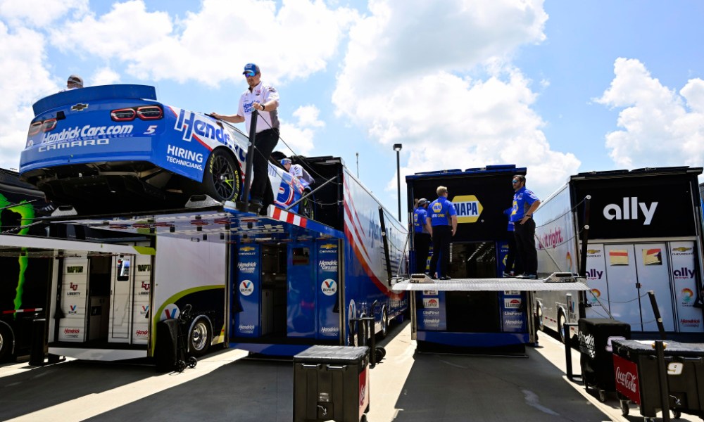 NASCAR pit crew loading racecar