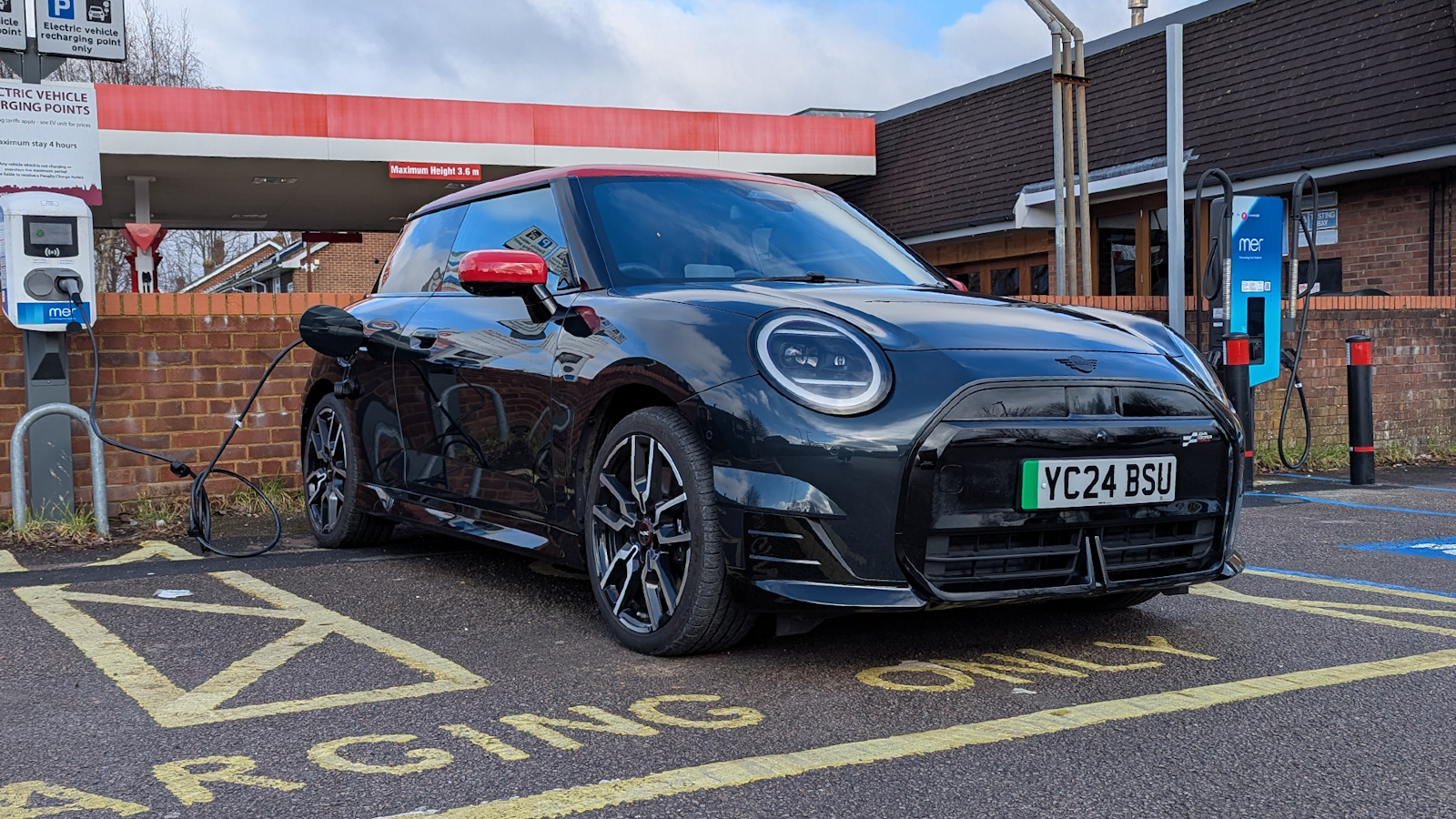 Mini Cooper SE charging at station