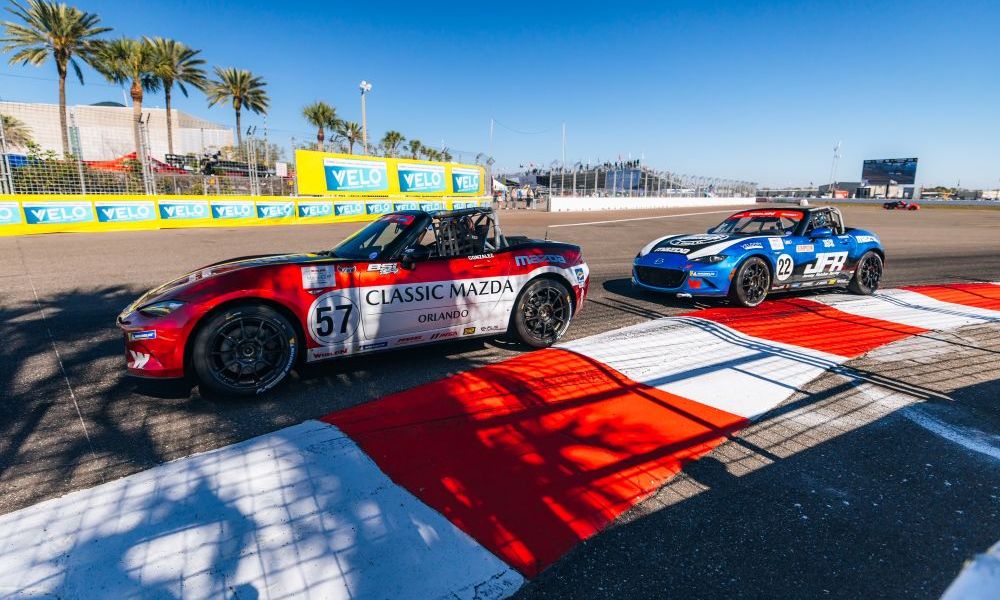 Two race cars battle on track