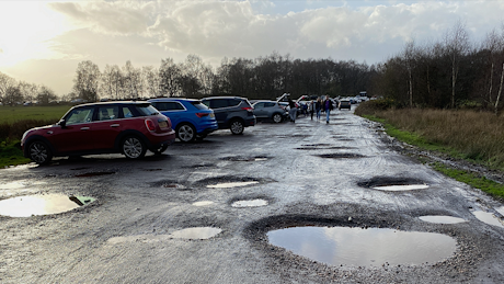 Potholed parking lot at Sutton Park