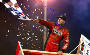 Racecar driver in red racing suit